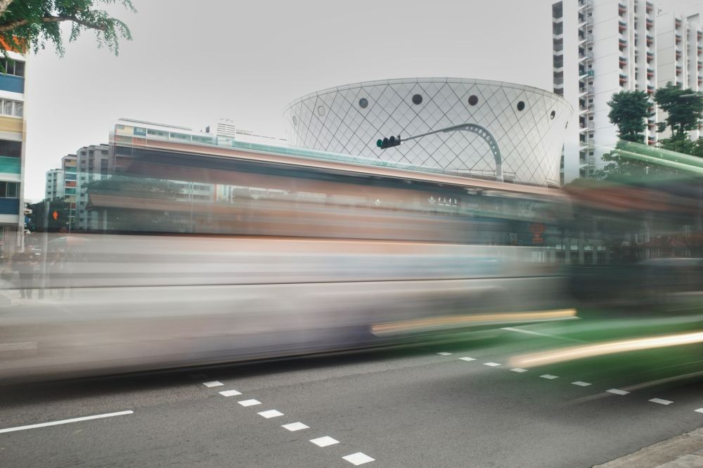 Bus & Train Fares Rise Up to 13 Cents from Dec 26 2 Commuters boarding a public bus in Singapore amid fare increase announcement
