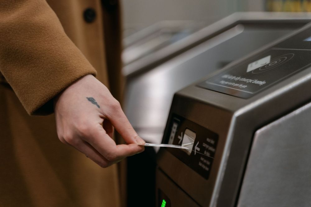 Bus & Train Fares Rise Up to 13 Cents from Dec 26 3 SimplyGo EZ-Link card being tapped at MRT gantry in Singapore