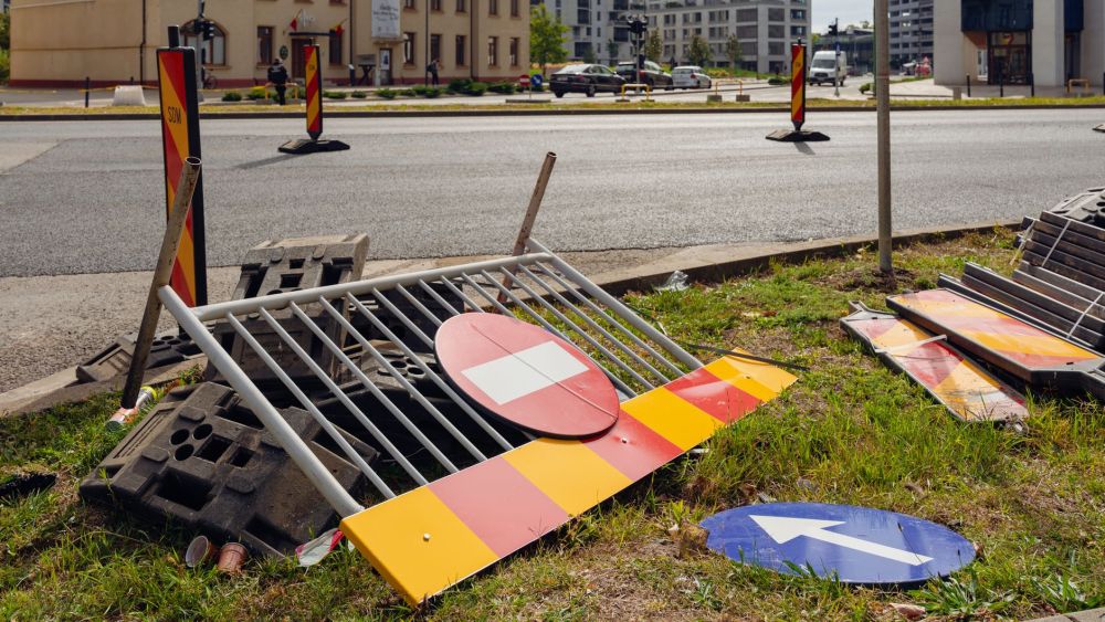 Temporary detour sign guiding pedestrians around a construction site hoarding