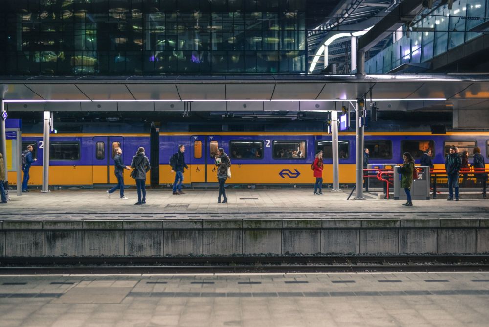 Commuters waiting calmly on a platform for the next train