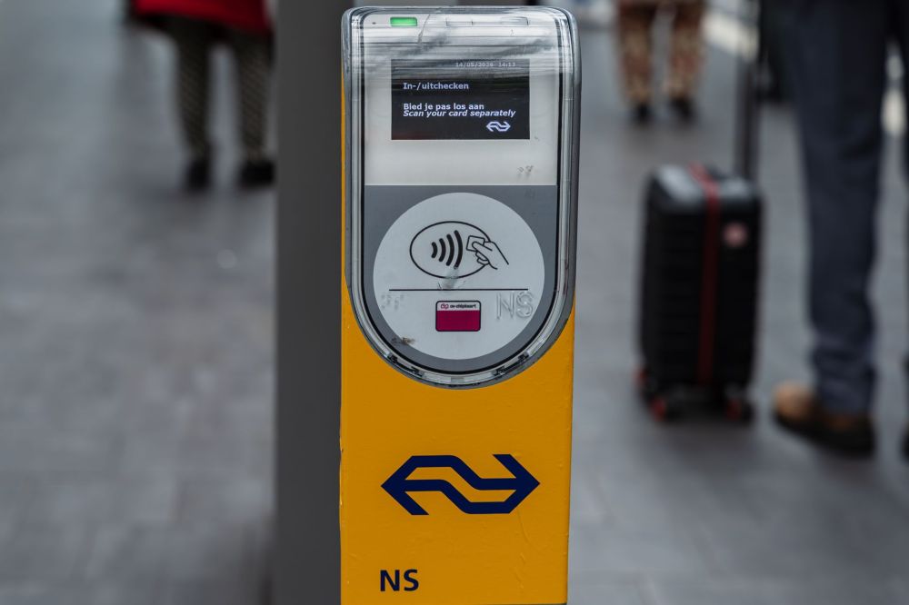 Jurong Region Line: How Tough Terrain Shaped the Build 5 Commuter tapping a contactless card at fare gates in a metro station