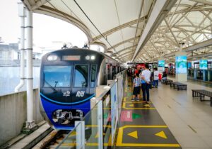 Commuters at an MRT station platform, a venue for ST audio news bulletins to reach daily travellers