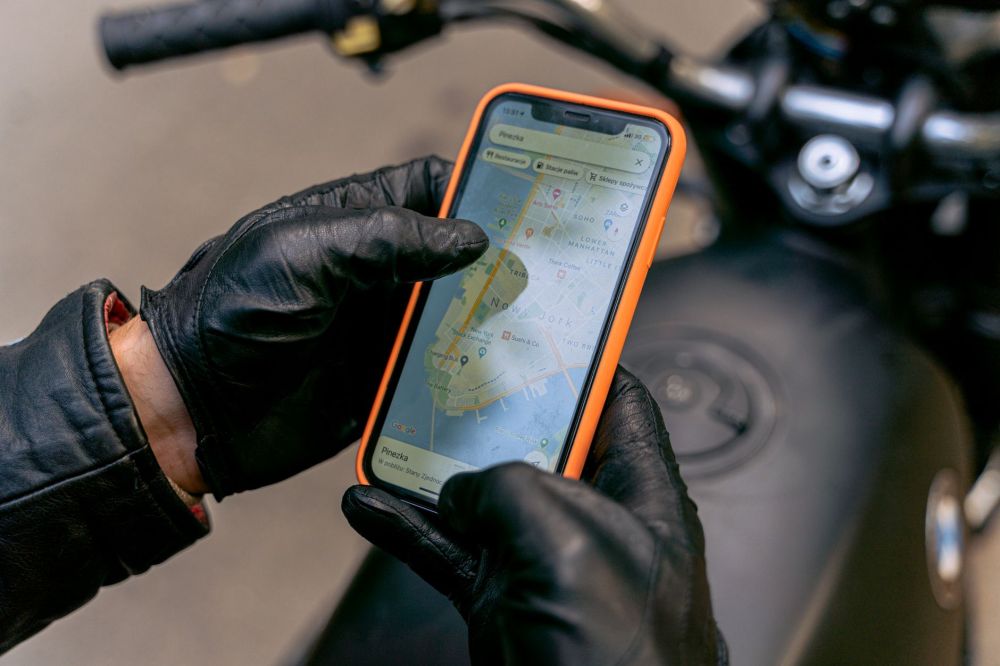 Commuter checking MRT and bus route alternatives on smartphone using journey planner